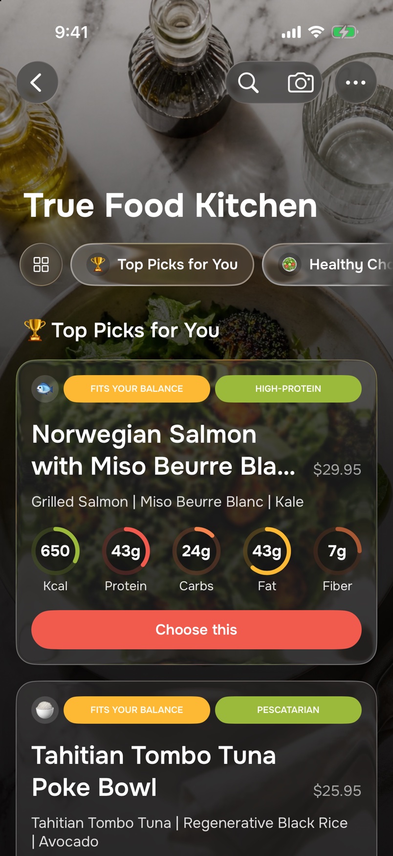 True Food Kitchen’s menu in MenuRight, under Top Picks for You: Norwegian Salmon with Miso Beurre Blanc, $29.95, labelled Fits your balance and High-protein, with an estimated 650 kcal, 43 g protein, 24 g carbs, 43 g fat and 7 g fiber, and a Choose this button.